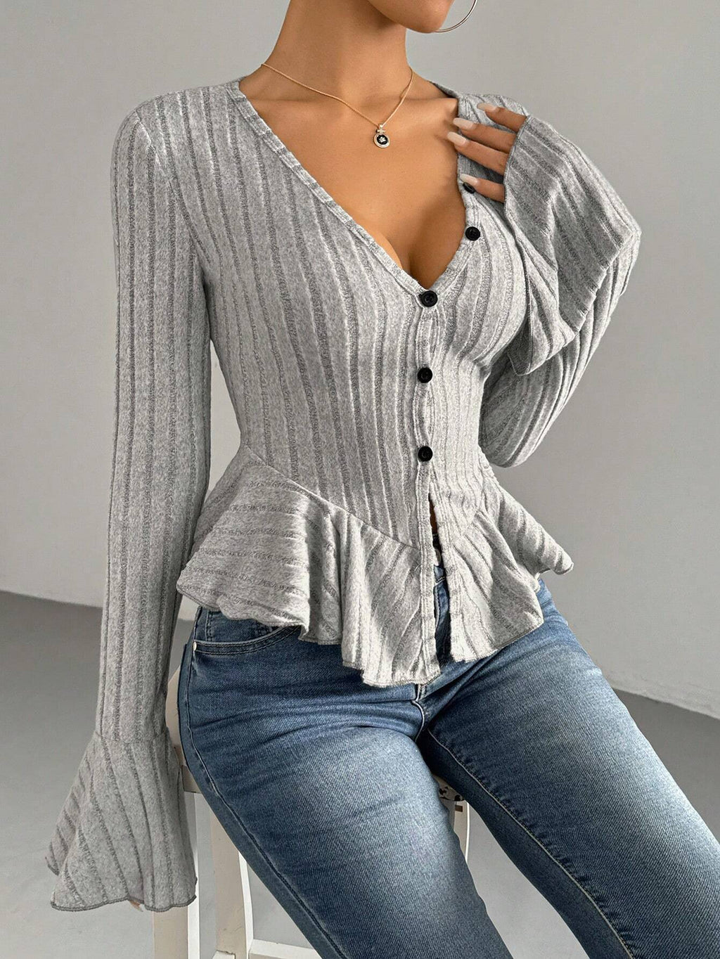 Léa Ruffled Peplum Knit Blouse